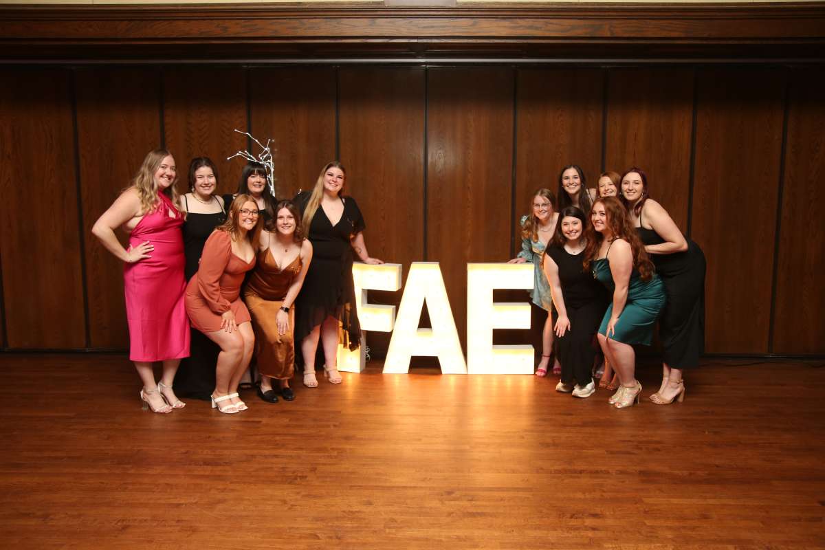 photo of sorority leaders with the letters FAE